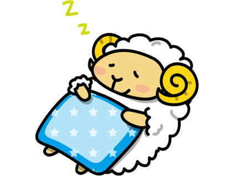 布団で眠る羊のイラスト